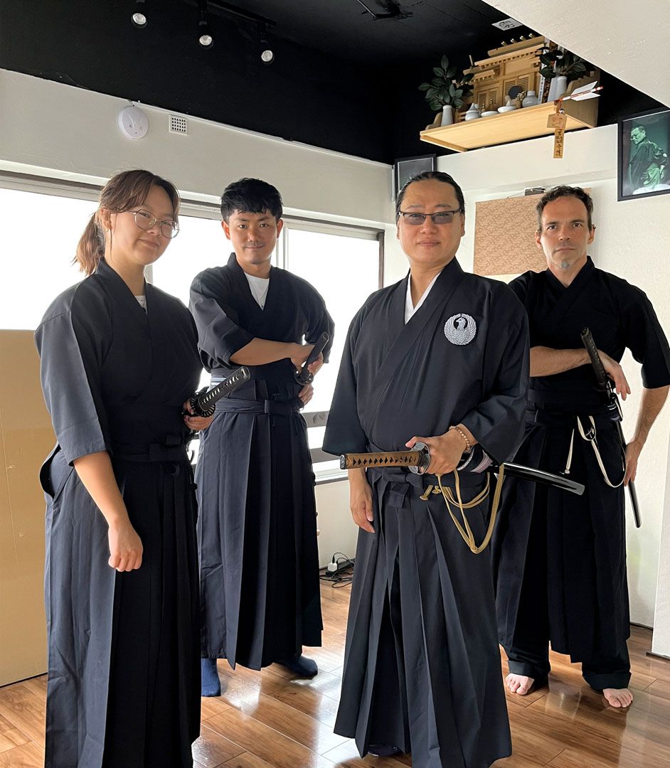 Language student practices with a Katakana Sword in traditional clothing