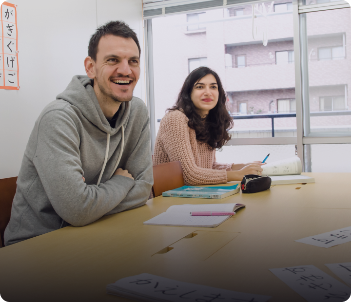 Language students laughing while enjoying class